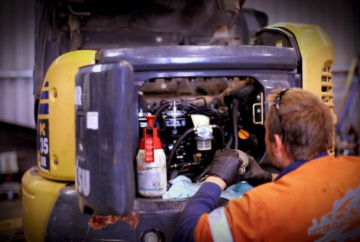 man is repairing the zero tail excavator